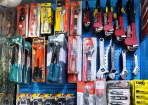 Pliers, riveters, adjustable and pipe wrenches on the tool wall at Al Abbas Hardware Mart